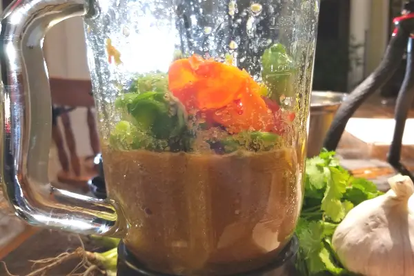 Blending the ingredients in a Caribbean hot sauce recipe