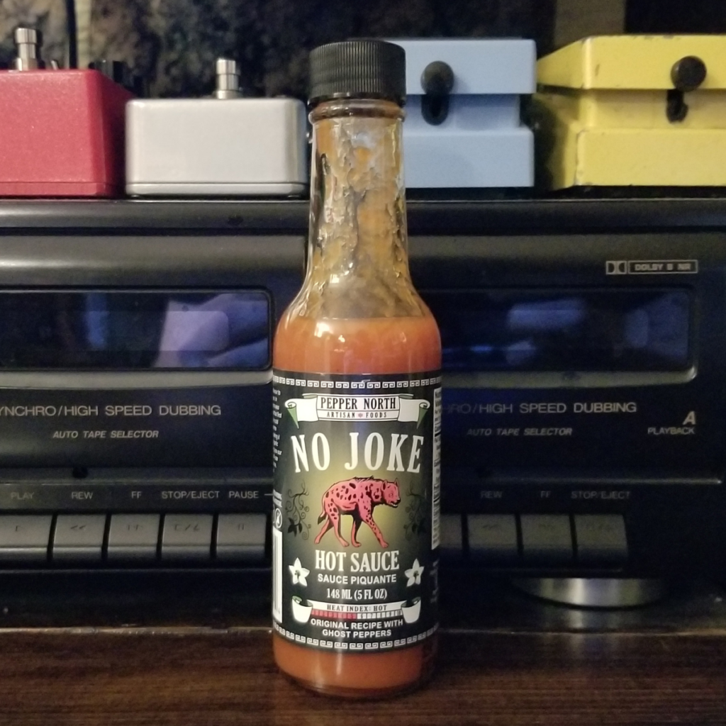 The front of bottle of Pepper North No Joke Hot Sauce