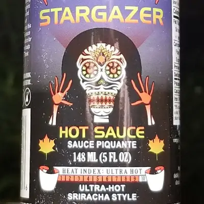 The cool space character on a bottle of Pepper North's Stargazer