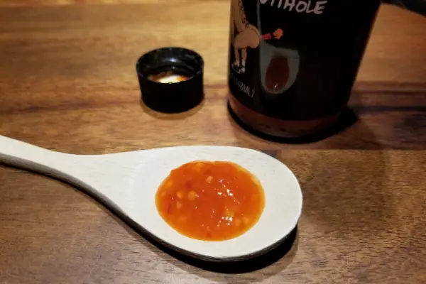 Steve O hot sauce on a spoon