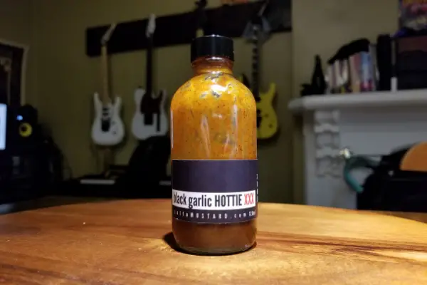A bottle of Black Garlic Hottie by Salt + Mustard