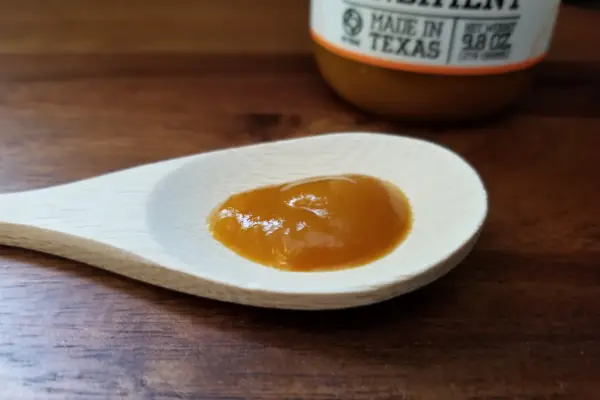 Yellowbird Habanero hot sauce on a spoon