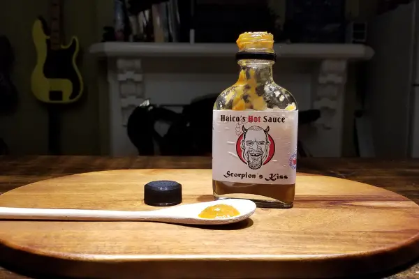 A bottle of Haico's Hot Sauce Scorpion Kiss on display