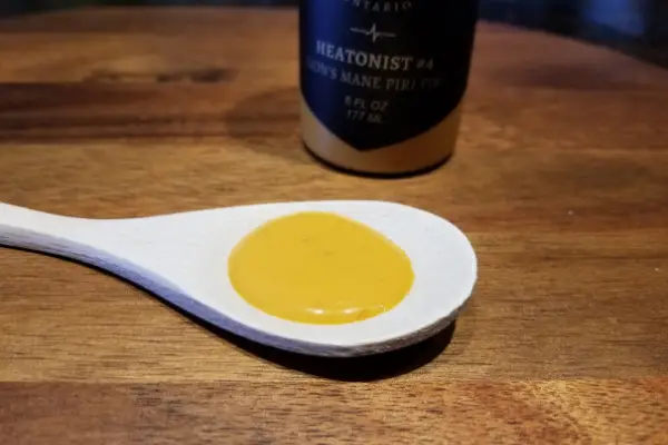 Heartbeat Lion's Mane Piri Piri sauce on a spoon