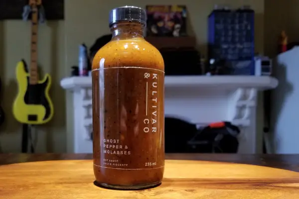 A bottle of Ghost Pepper and Molasses hot sauce by Kultivar & Co.