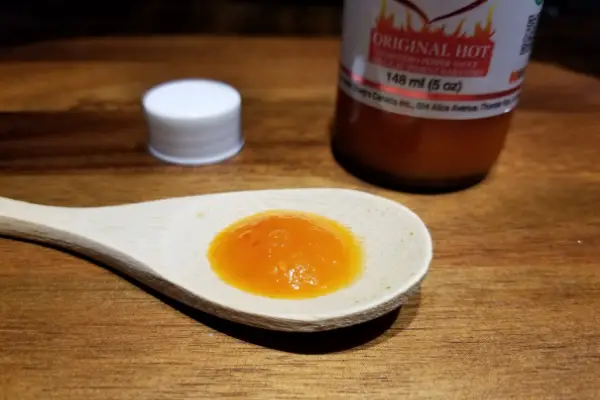 Marie Sharps Original Hot Habanero sauce on a spoon
