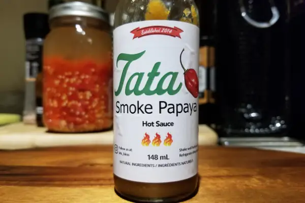 The label on a bottle of Smoke Papaya by Tata Hot Sauce Emporium