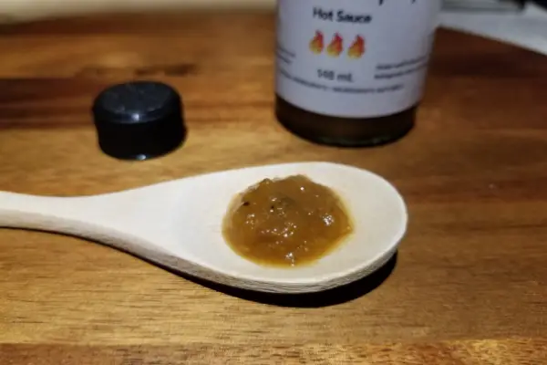 Tata Hot Sauce Emporium's Smoke Papaya on a spoon