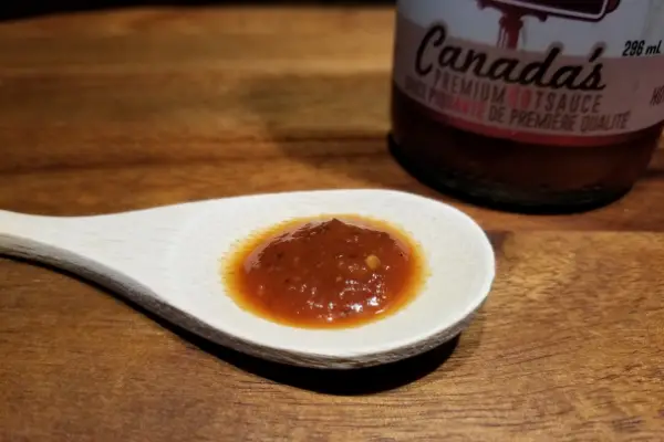 Front St Heat hot sauce on a spoon