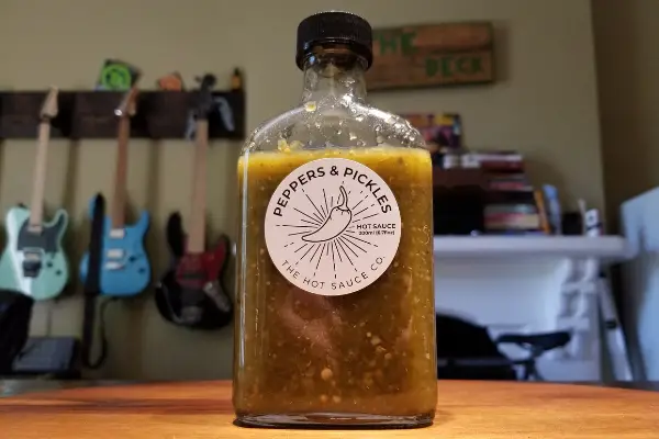 A bottle of Peppers and Pickles by The Hot Sauce Co