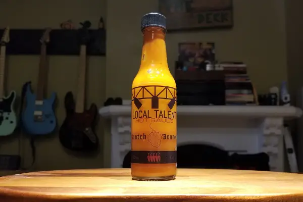 A bottle of scotch bonnet by local talent