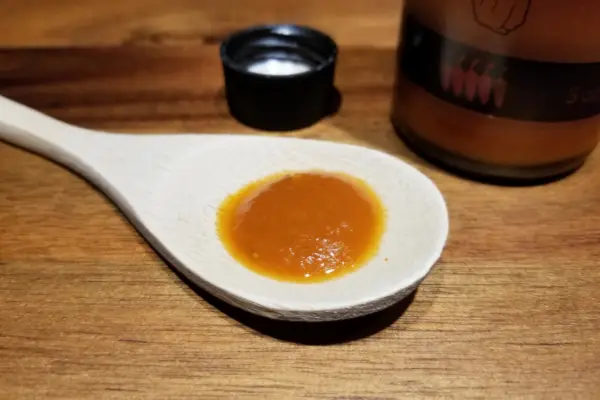 Scotch Bonnet sauce by Local Talent on a spoon