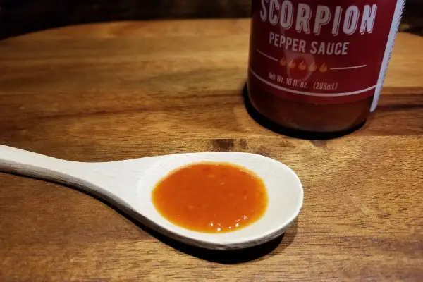 Melinda's Scorpion Pepper Sauce on a spoon