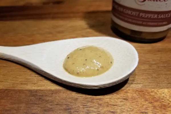 Dawson's Sichuan Ghost Pepper Hot Sauce on a spoon