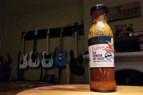 A bottle of Rootham's red crimson hot sauce