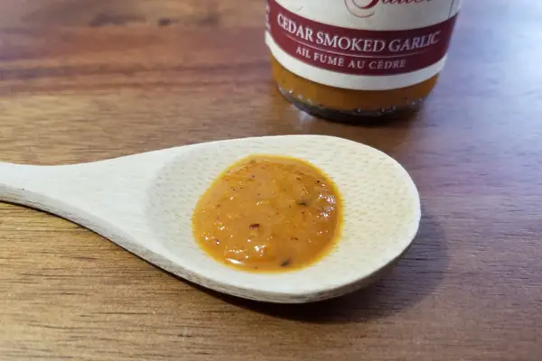 Cedar Smoked Garlic hot sauce on a spoon to show texture