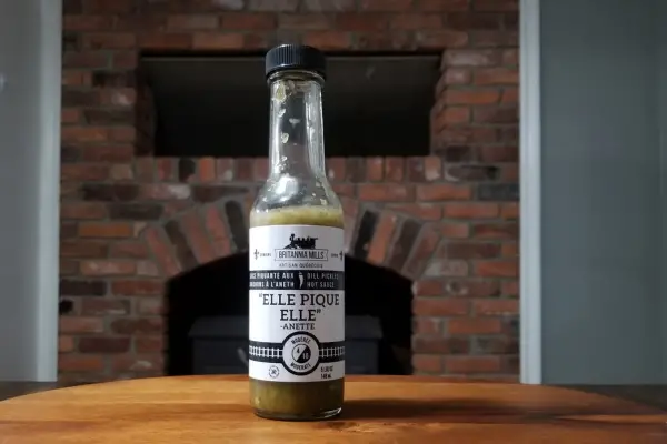 A bottle of Elle Pique Elle hot sauce by Britannia Mills