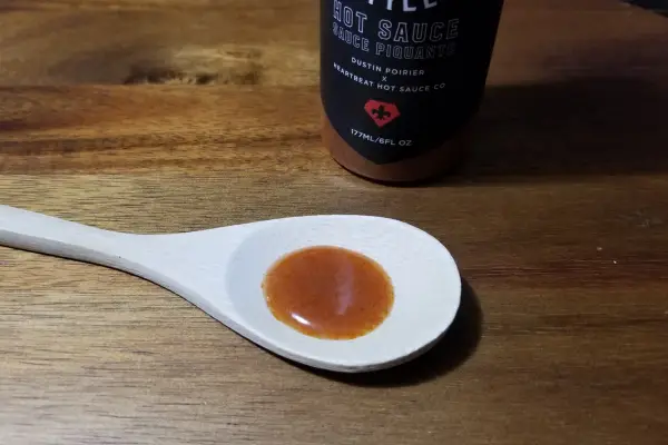 Lousiana Style Hot Sauce on a spoon to show texture