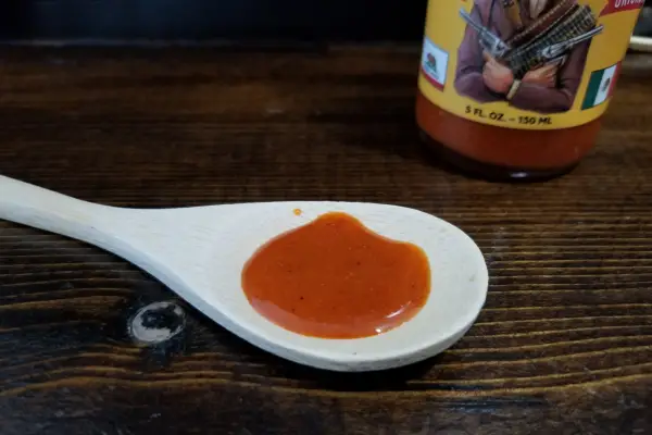 Original Red Sauce from Gringo Bandito on a spoon to show texture