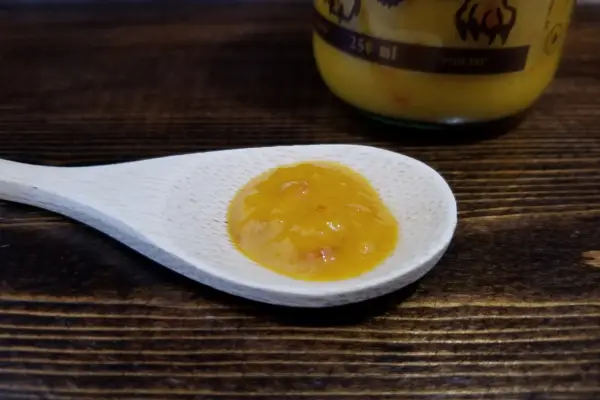 Bajan Tyga hot sauce on a spoon to show texture