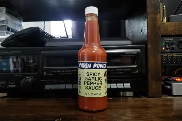 a bottle of Cajun Power's Spicy Garlic Pepper Sauce