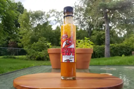 A bottle of Franks Ghost hot sauce from The Capsaicin Cartel