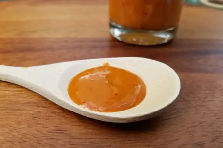 Frank's Ghost hot sauce on a spoon to show texture