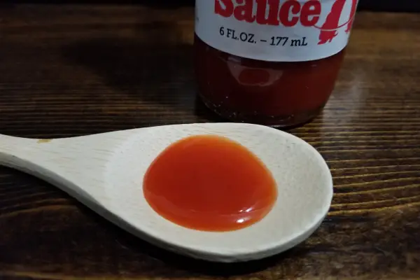 Texas Pete Original Hot Sauce on a spoon to show texture