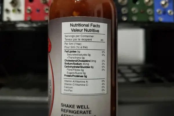 A bottle of Polski Style hot sauce by Cooksville showing the nutritional label