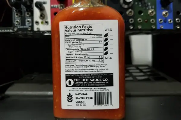 The nutritional info on a bottle of Scorpion Sriracha by The Hot Sauce Co.