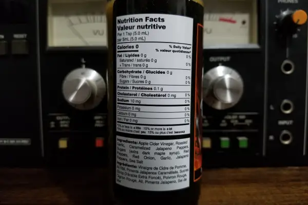The nutritional info on a bottle of Beauty hot sauce by Sorry Sauce