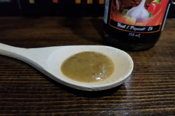 Beauty hot sauce by Sorry Sauce on a spoon to show texture