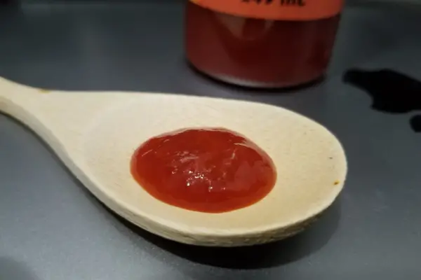 Xtra Tingly Sauce on a spoon to show texture