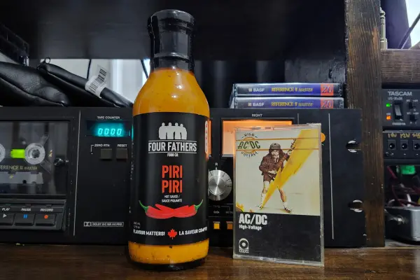 A bottle of Piri Piri Hot Sauce by Four Fathers Food Co.