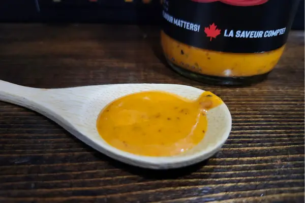 Four Fathers Food Co. Piri Piri Sauce on a spoon to show texture. 