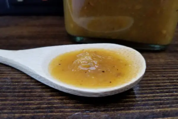 Habanero & Herbs hot sauce on a spoon to show texture
