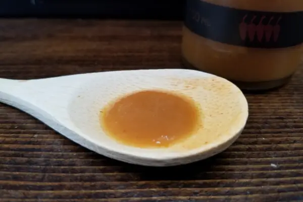 Local Talent's Trinidad Scorpion hot sauce on a spoon to show texture
