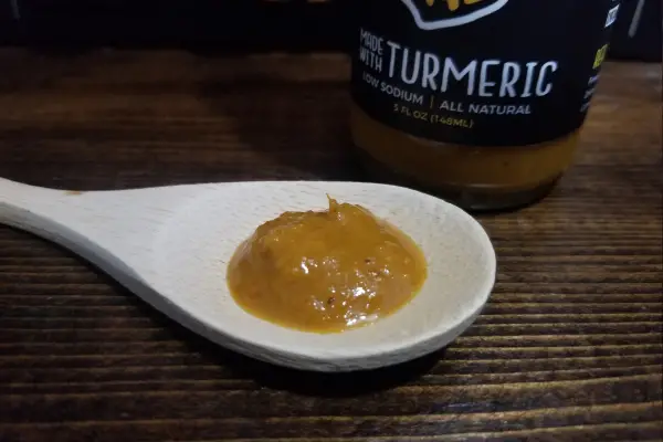 Hotter Habanero Sauce by Sauce Bae on a spoon to show texture.