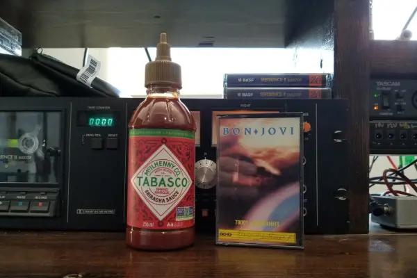 A bottle of Tabasco Sriracha sauce.