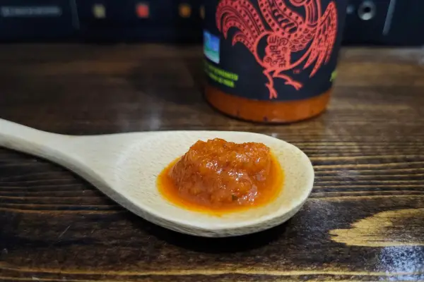 Kimchi Sriracha on a spoon to show texture