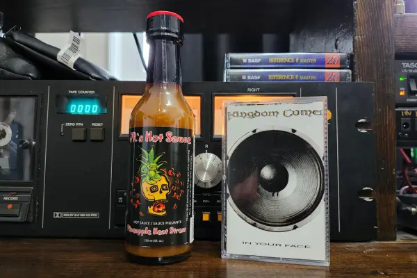 A bottle of Pineapple Heat Stress by JR's Hot Sauce