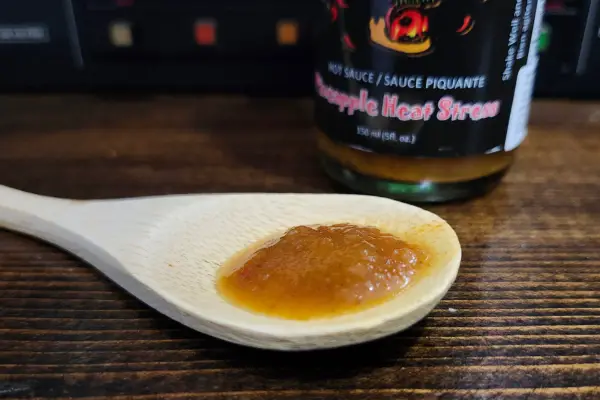 Pineapple Heat Stress by JR's Hot Sauce on a spoon to show texture