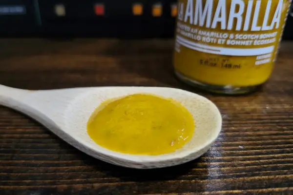 La Amarilla hot sauce by Matute Sauce Co. on a spoon to show texture.
