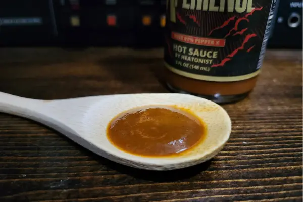 Last Dab Xperience Hot One Hot Sauce on a spoon to show texture