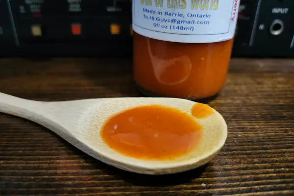 Habanero Strawberry by Hi Guys Hot Sauce on a spoon to show texture