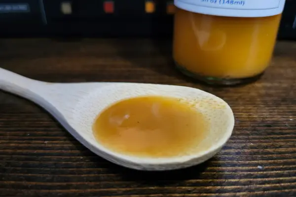 Habanero Mango Hot Sauce by Hi Guys on a spoon to show texture. 