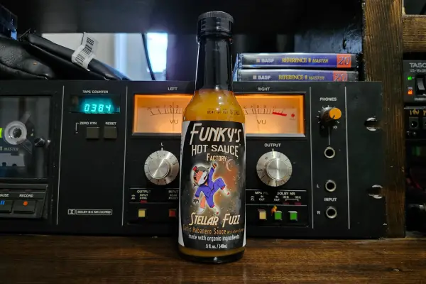 A bottle of Stellar Fuzz by Funky's Hot Sauce Factory