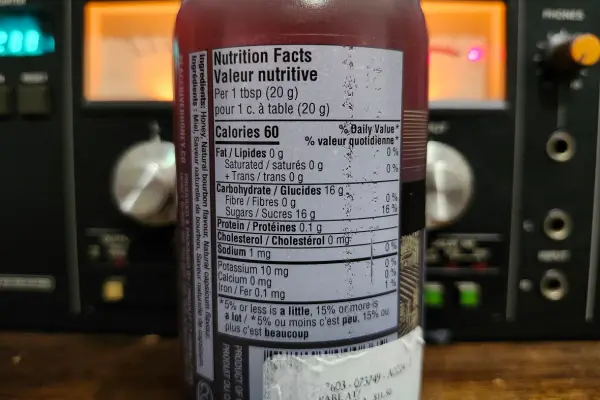 The nutritional info panel on a bottle of Bourbon Hot by Peace River Honey