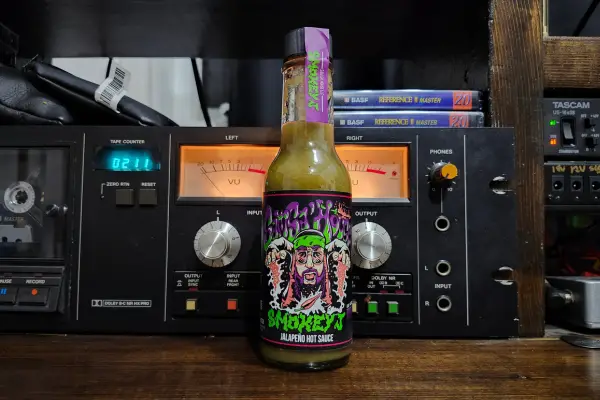 A bottle of Smokey J hot sauce by Sam Sa House