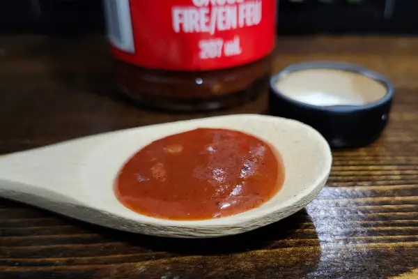 Taco Bell Fire Hot Sauce on a spoon to show texture